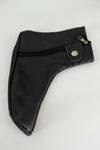 Close-up of black leather shoe cover texture, stitching, zipper, and closure