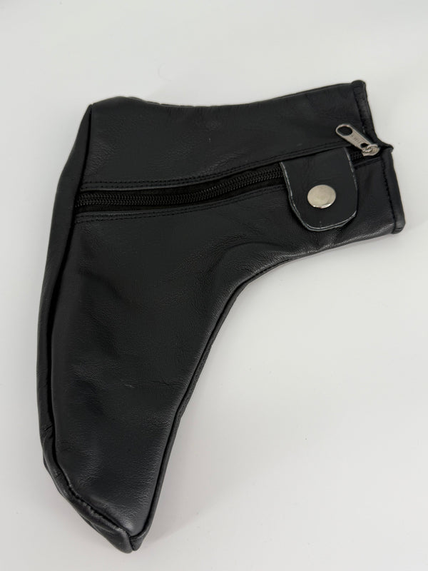 Close-up of black leather shoe cover texture, stitching, zipper, and closure