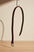 Reversible black and brown leather belt with rotating buckle in a clean product presentation