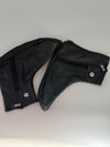 Black leather shoe covers shown as a pair with side zipper and snap closure