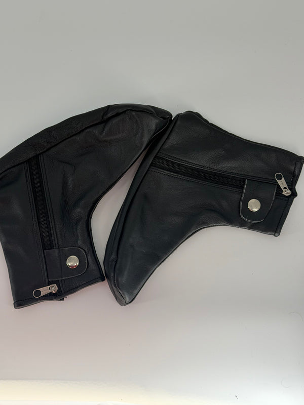 Black leather shoe covers shown as a pair with side zipper and snap closure