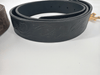 Crazy horse leather belt in brown with visible grain and buckle on a clean presentation