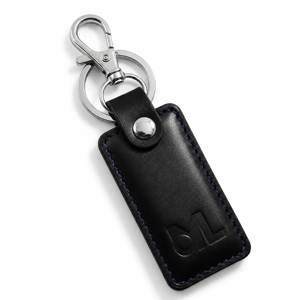 Black leather rectangular keychain with purple stitching and silver hardware