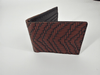 Patterned genuine leather bifold wallet in a clean premium product presentation