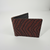 Patterned genuine leather bifold wallet in a clean premium product presentation