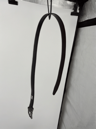 Reversible black and brown leather belt with rotating buckle in a clean product presentation